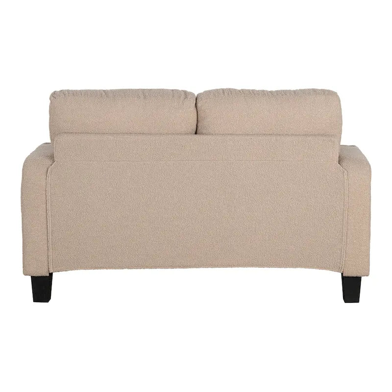 Canapé deux places en tissu bouclé beige avec porte-gobelets, poches latérales et coussins décoratifs
