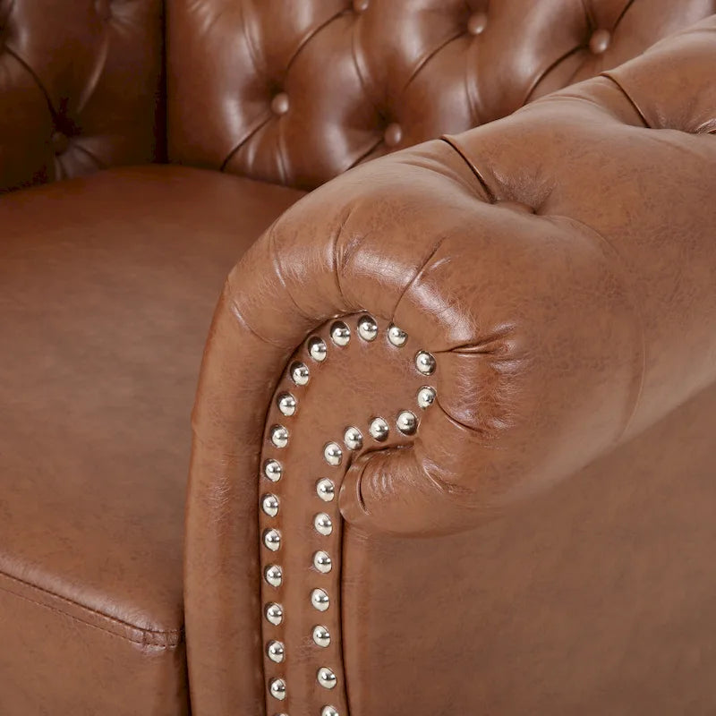 Fauteuil club Chesterfield capitonné en similicuir marron cognac avec clous décoratifs