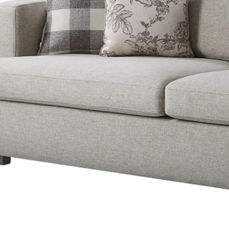 Canapé en tissu beige avec accoudoirs droits et pieds en bois massif marron